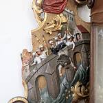 Cerhenice - kostel sv. Jana Nepomuckého, detail kartuše shození sv. Jana nepomuckého z mostu (2017)